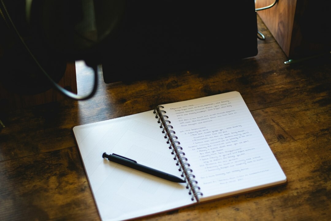 mystery writer at desk with notebook