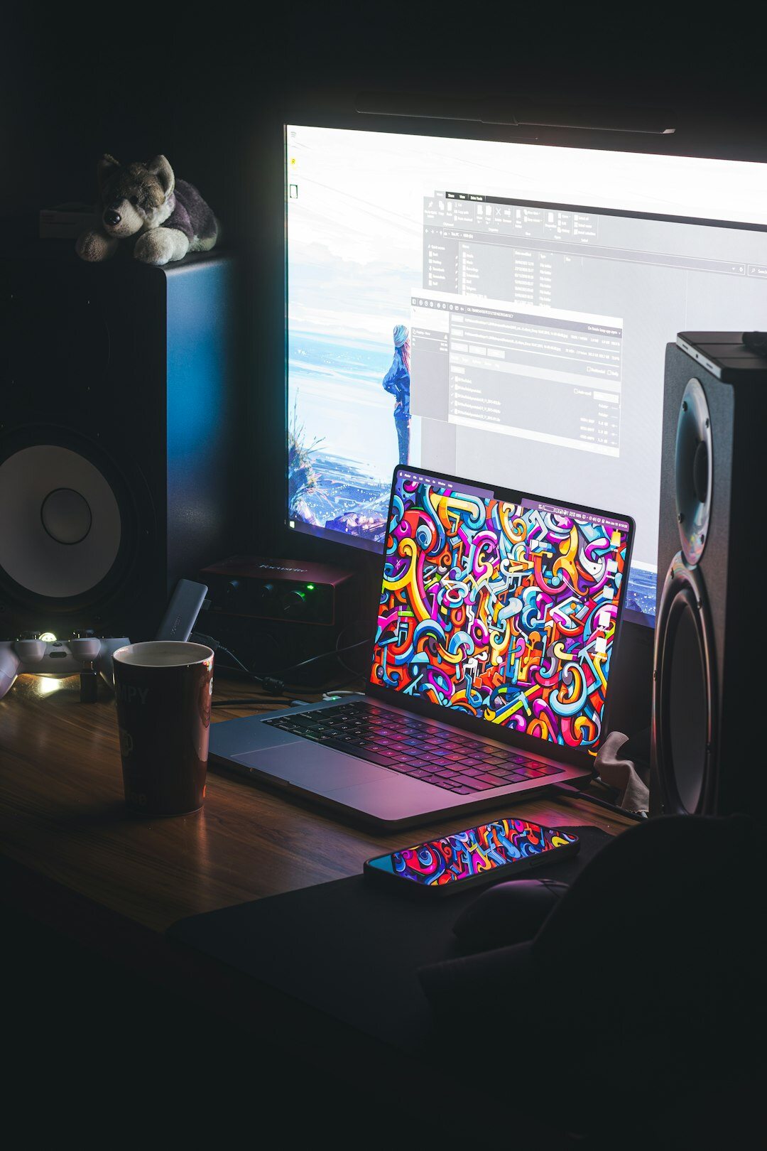 writer typing on laptop in dim room